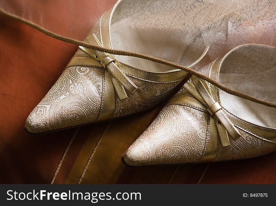 Beautiful designer bride's shoes with bows for the wedding party. Beautiful designer bride's shoes with bows for the wedding party
