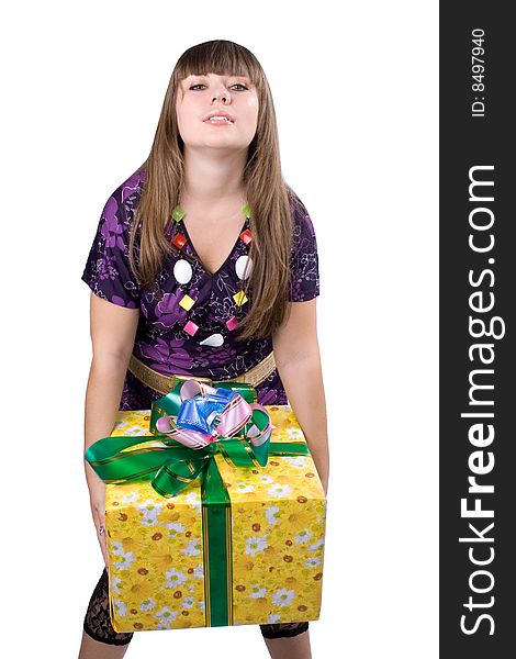 The young beautiful girl with a gift box on a color background. The young beautiful girl with a gift box on a color background