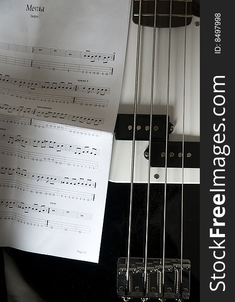 Bass guitar with tabulature near. taked during my practice with bass