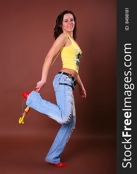 The young beautiful girl during active leisure on a white background