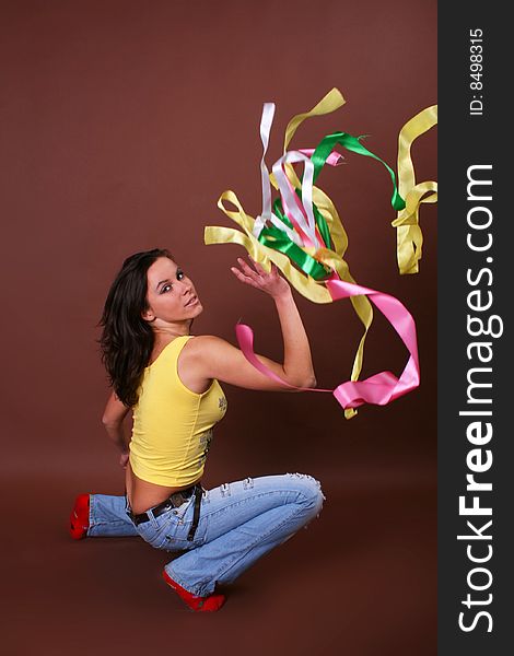 The young beautiful girl during active leisure on a white background