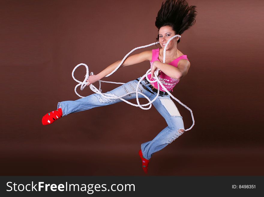 The young beautiful girl during active leisure on a white background