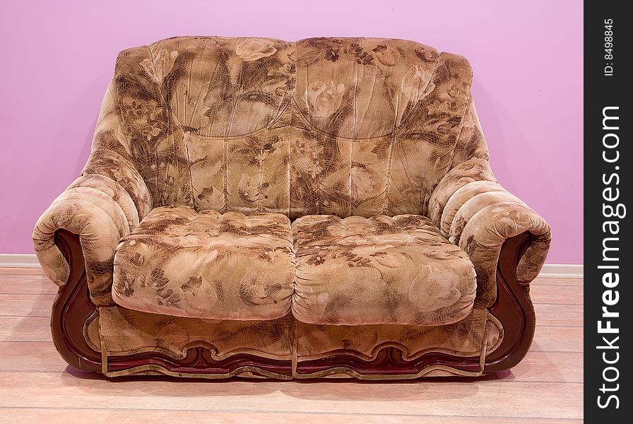 Brown soft sofa on purple background