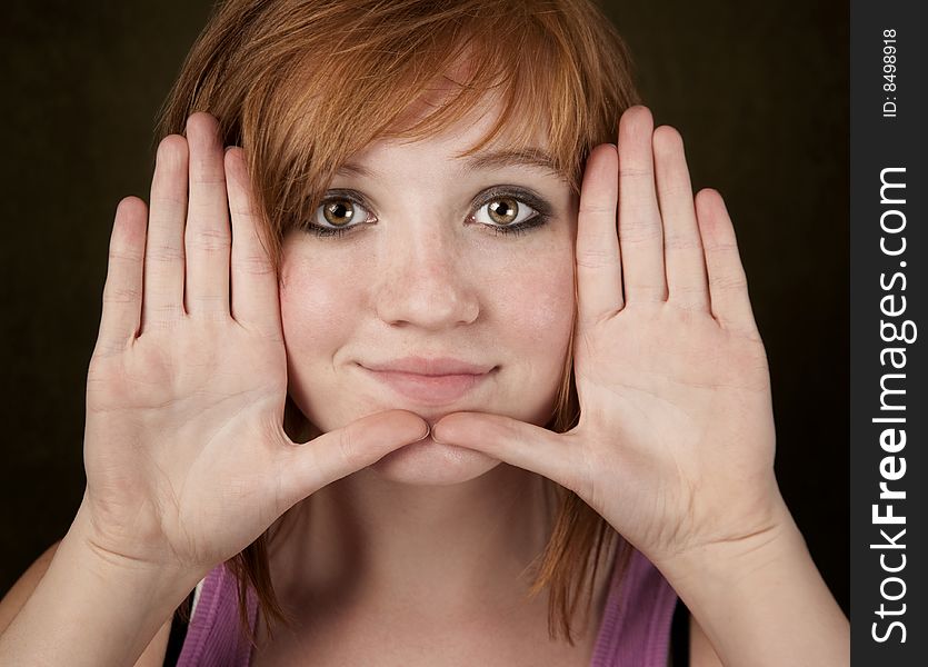 Pretty Teenager Framing Her Face