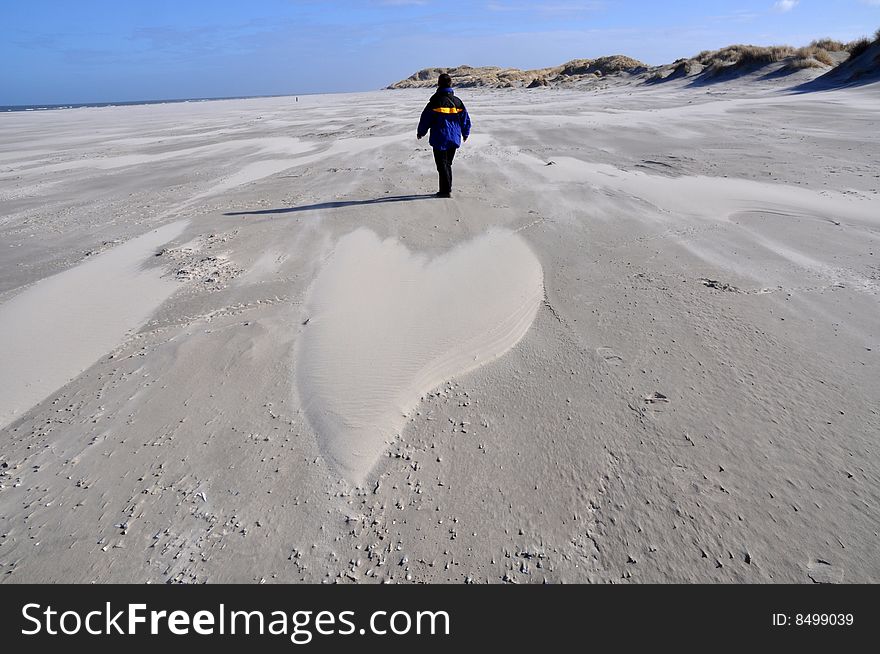 Sandy heart formed by wind on a beach. Sandy heart formed by wind on a beach