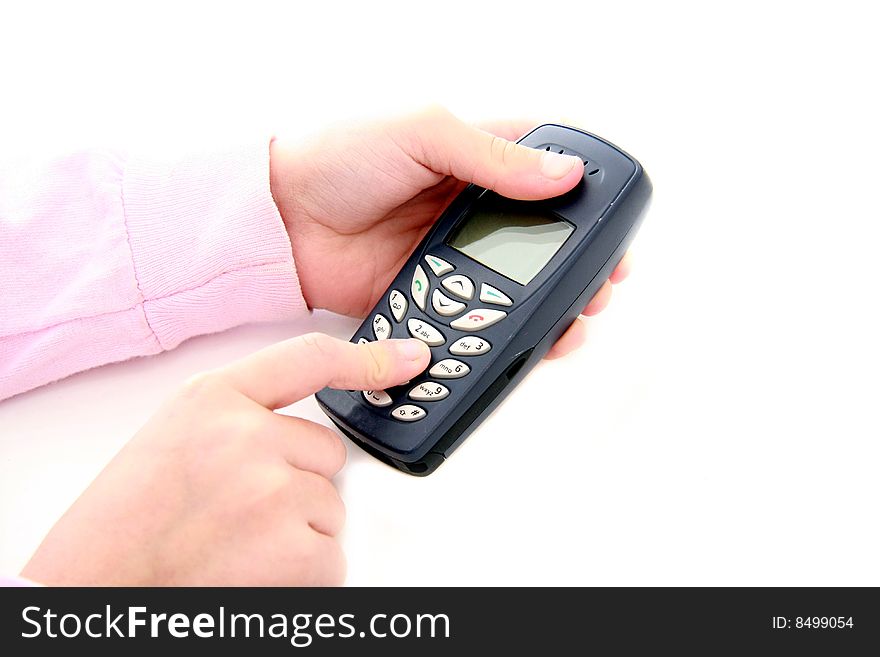 Child holding cell phone and dialing. Child holding cell phone and dialing