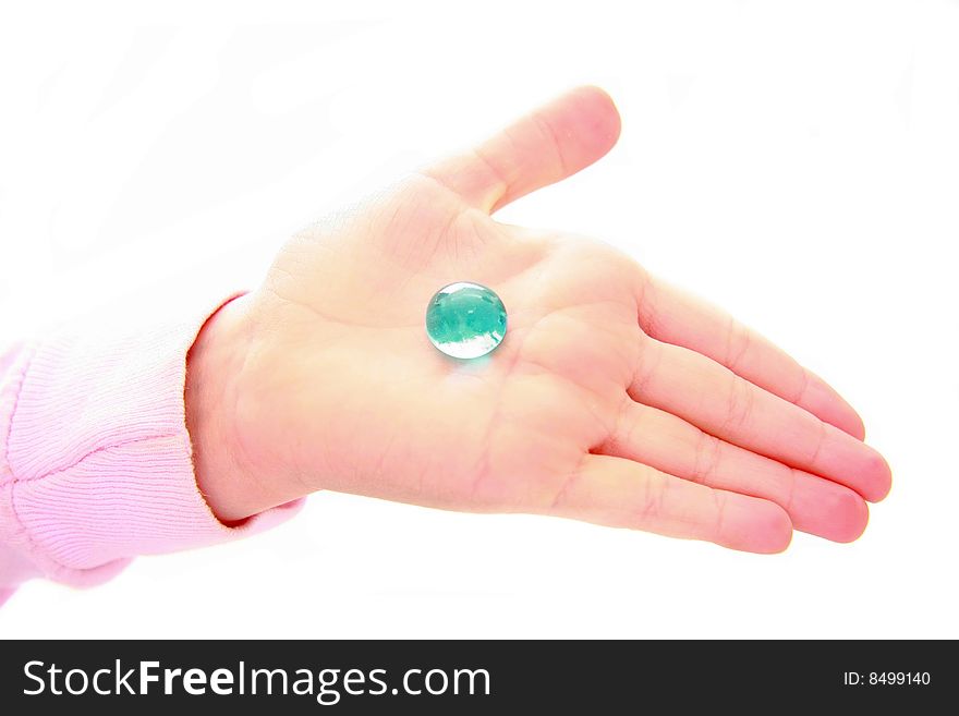 Child holding blue stone in hand