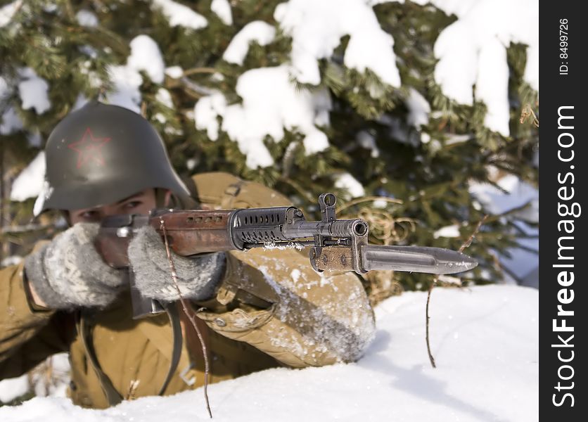 Red Army soldier aims from a rifle