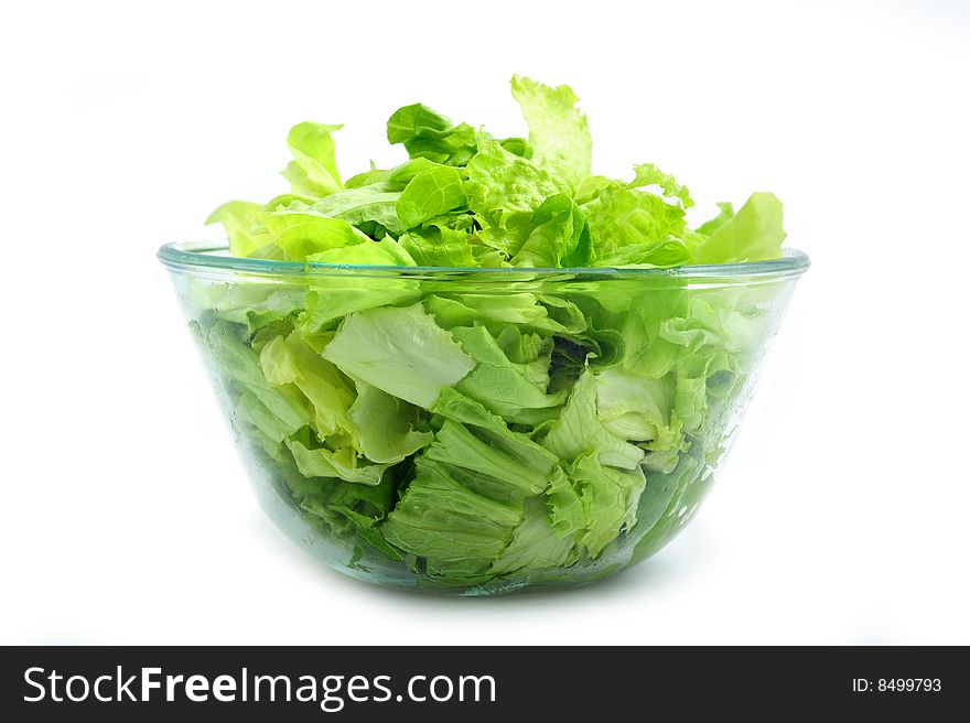 Green salad on bowl on white background