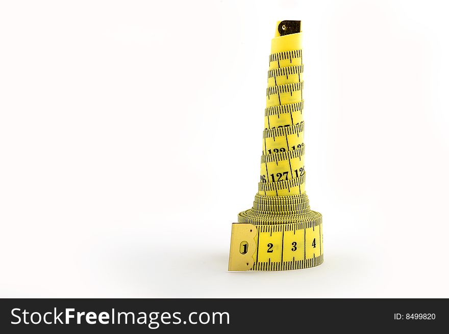 Yellow tape measure in tower shape
