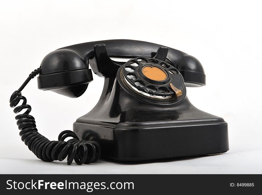 Black old style telephone on white background. Black old style telephone on white background