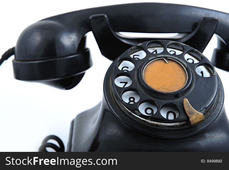 Black old style telephone on white background. Black old style telephone on white background