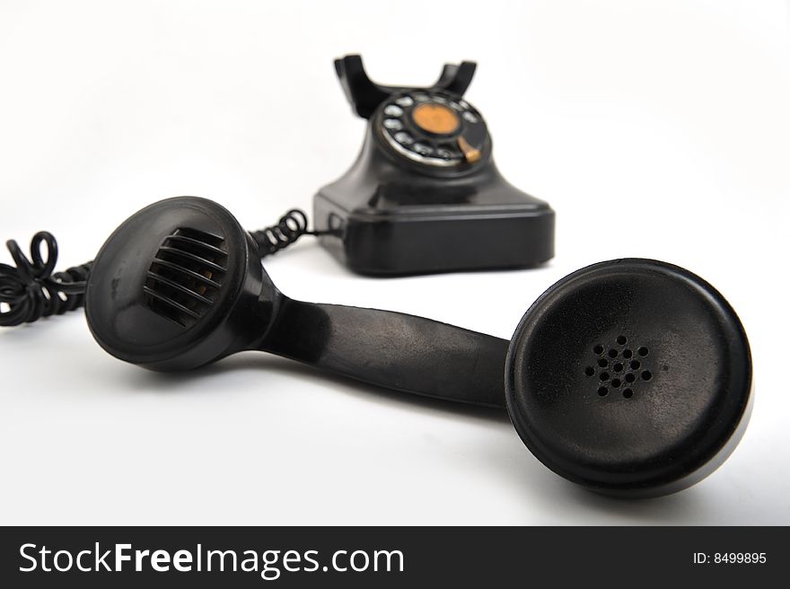 Black old style telephone on white background. Black old style telephone on white background