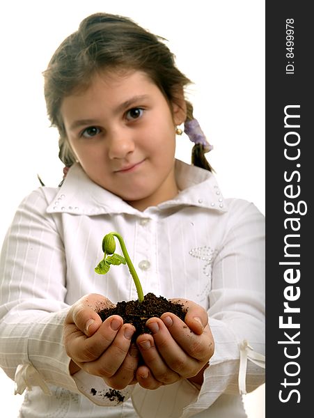 Girl holding a bud and earth in hands. Girl holding a bud and earth in hands