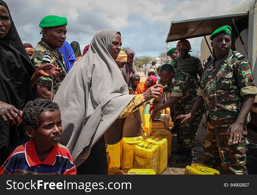 Burundian troops serving with the African Union Mission in Somalia &#x28;AMISOM&#x29; distribute fresh, potable drinking water in the village of Modmoday approx. 40km east of the central Somali town of Baidoa. The Burundians, together with forces of the Somali National Army &#x28;SNA&#x29; have been mounting &#x27;snap&#x27; foot patrols in villages and areas to the east of Baidoa where Al Qaeda-affiliated extremist group Al Shabaab mount attacks against local herdsmen, villages and travelers along the busy Baidoa-Mogadishu road. The AMISOM troops also use the patrols as an opportunity to provide occasional free medical treatment and drinking water for residents in the area. AU/UN IST PHOTO / ABDI DAKAN. Burundian troops serving with the African Union Mission in Somalia &#x28;AMISOM&#x29; distribute fresh, potable drinking water in the village of Modmoday approx. 40km east of the central Somali town of Baidoa. The Burundians, together with forces of the Somali National Army &#x28;SNA&#x29; have been mounting &#x27;snap&#x27; foot patrols in villages and areas to the east of Baidoa where Al Qaeda-affiliated extremist group Al Shabaab mount attacks against local herdsmen, villages and travelers along the busy Baidoa-Mogadishu road. The AMISOM troops also use the patrols as an opportunity to provide occasional free medical treatment and drinking water for residents in the area. AU/UN IST PHOTO / ABDI DAKAN.