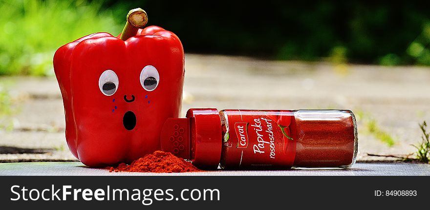 Red Pepper Beside Red Paprika Plastic Bottle