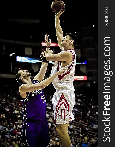 Yao Ming Holding Basketball on His Left Hand While Jumping