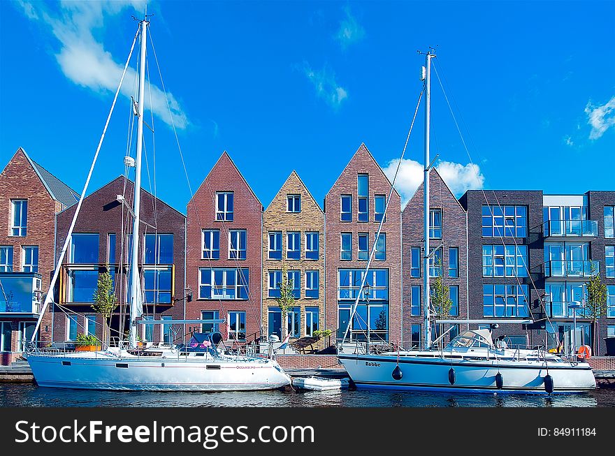 A view of a town with old brick houses at the harbor. A view of a town with old brick houses at the harbor.