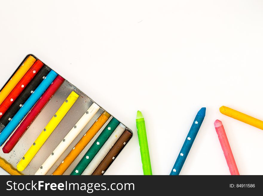A set of colorful crayons on a white background.