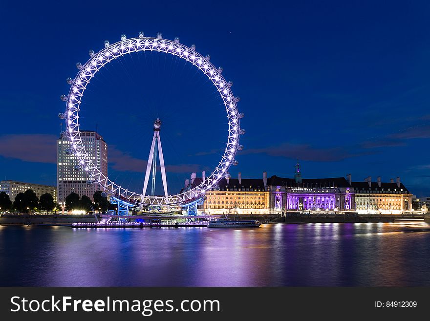The London Eye ferris wheel at night.