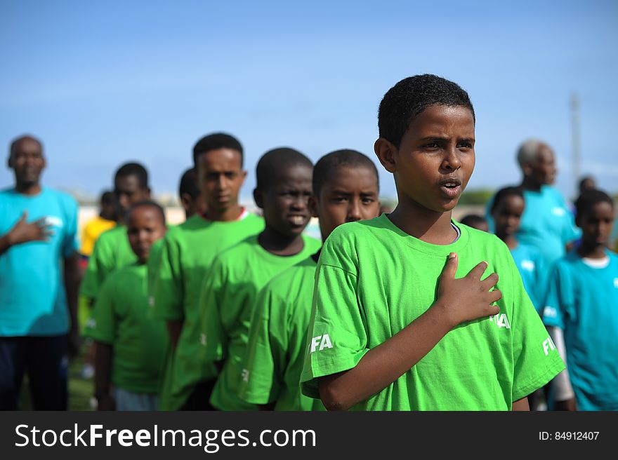 Children sing the national anthem before the start of the FIFA Football Festival in Mogadishu, Somalia, on August 19. FIFA, having had no presence in Somalia for the last 26 years, today held its first training session in Mogadishu since the country fell into civil war. Illegal under al Shabab, football has made a huge comeback in Somalia, with Mogadishu&#x27;s streets literally filling up with children each afternoon as they come out to play the game. AU UN IST PHOTO / TOBIN JONES. Children sing the national anthem before the start of the FIFA Football Festival in Mogadishu, Somalia, on August 19. FIFA, having had no presence in Somalia for the last 26 years, today held its first training session in Mogadishu since the country fell into civil war. Illegal under al Shabab, football has made a huge comeback in Somalia, with Mogadishu&#x27;s streets literally filling up with children each afternoon as they come out to play the game. AU UN IST PHOTO / TOBIN JONES.