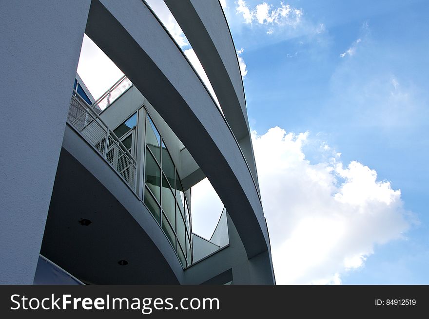 A closeup of a modern building with round structures. A closeup of a modern building with round structures.