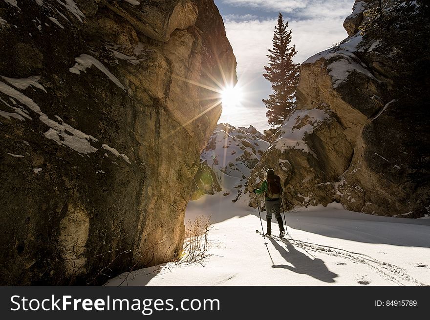 Man Hiking in Snowy Mountain