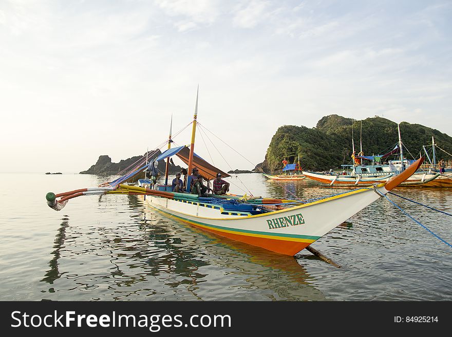 Thin Colorful Boat with Awning