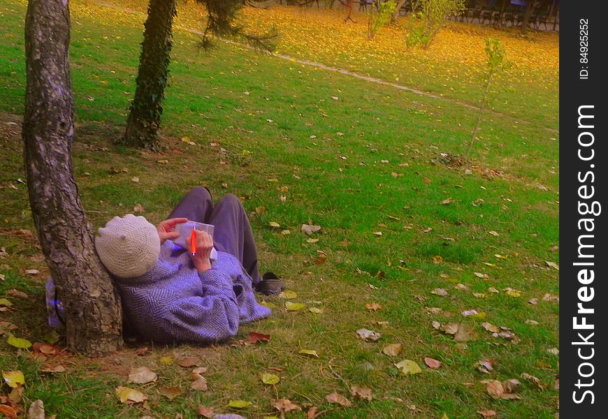 woman writing in the park