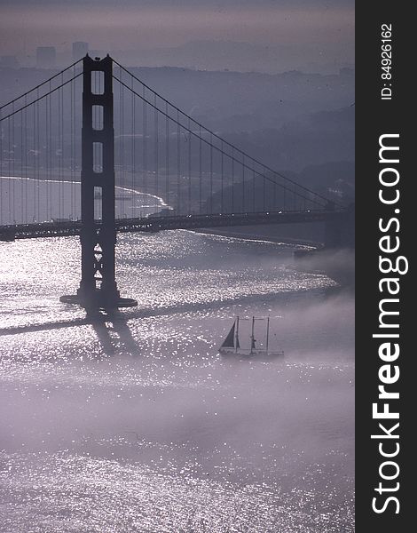 Golden Gate Bridge in fog 2 &#x28;with sailboat&#x29;