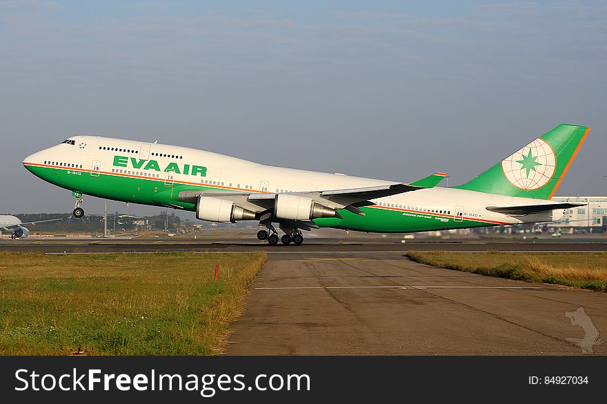 Eva Air airliner on runway at take-off on sunny day. Eva Air airliner on runway at take-off on sunny day.