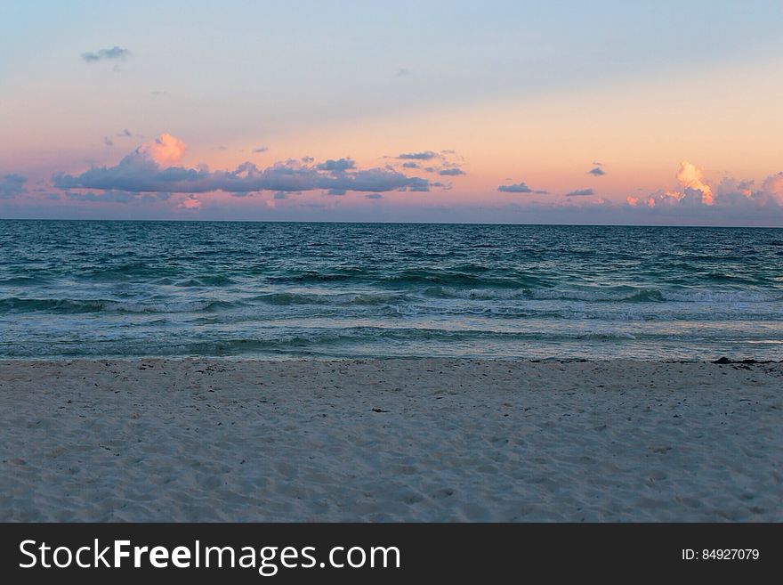 Ocean Waves on Beach at Sunset