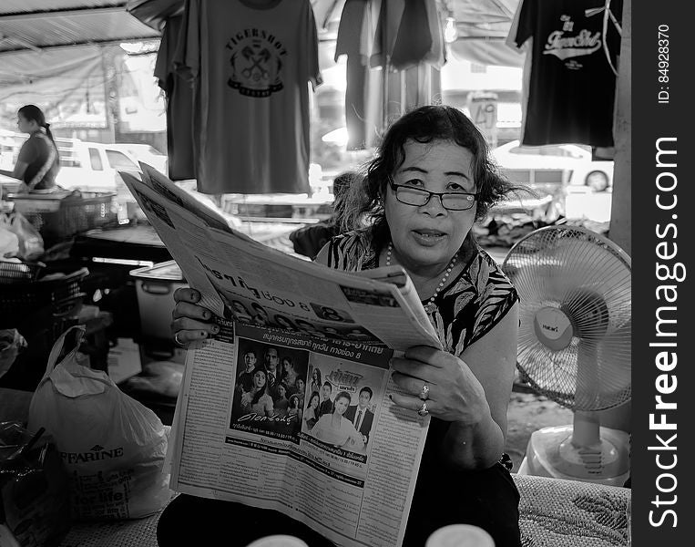 Reading Woman, Mae Phim Market. Thailand