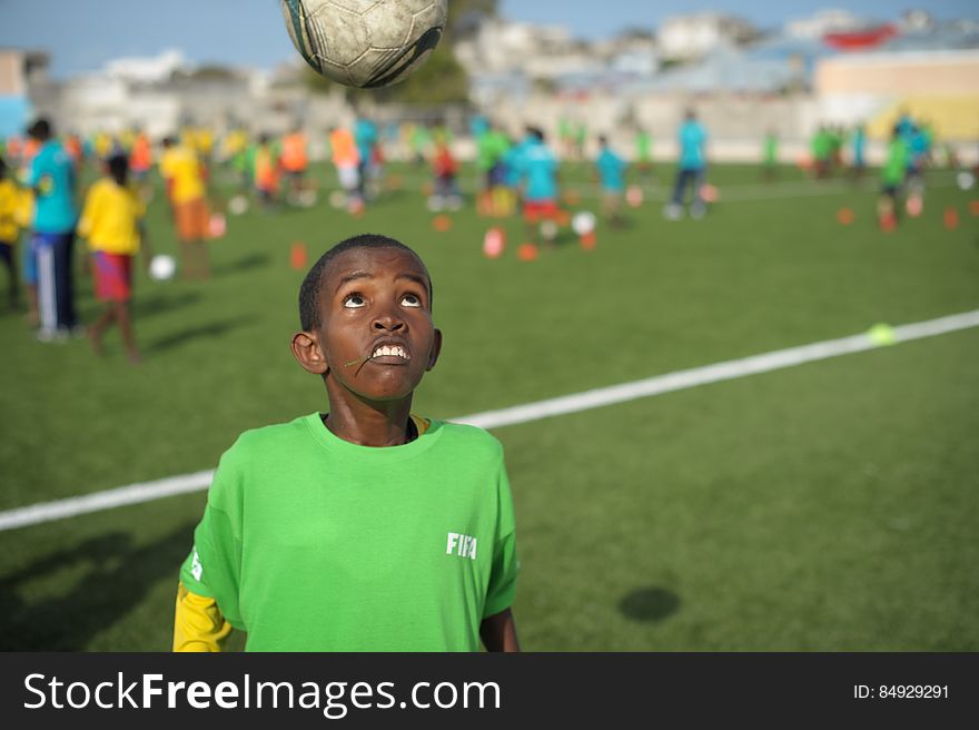 A child headers a ball during practice at the FIFA Football Festival in Mogadishu, Somalia, on August 19. FIFA, having had no presence in Somalia for the last 26 years, today held its first training session in Mogadishu since the country fell into civil war. Illegal under al Shabab, football has made a huge comeback in Somalia, with Mogadishu&#x27;s streets literally filling up with children each afternoon as they come out to play the game. AU UN IST PHOTO / TOBIN JONES. A child headers a ball during practice at the FIFA Football Festival in Mogadishu, Somalia, on August 19. FIFA, having had no presence in Somalia for the last 26 years, today held its first training session in Mogadishu since the country fell into civil war. Illegal under al Shabab, football has made a huge comeback in Somalia, with Mogadishu&#x27;s streets literally filling up with children each afternoon as they come out to play the game. AU UN IST PHOTO / TOBIN JONES.