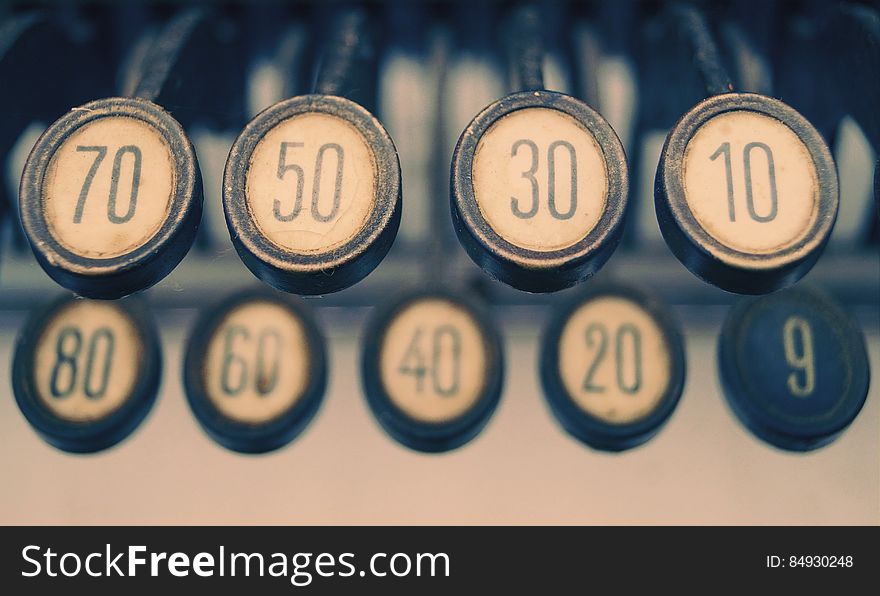 Closeup of vintage typewriter keys with numbers.