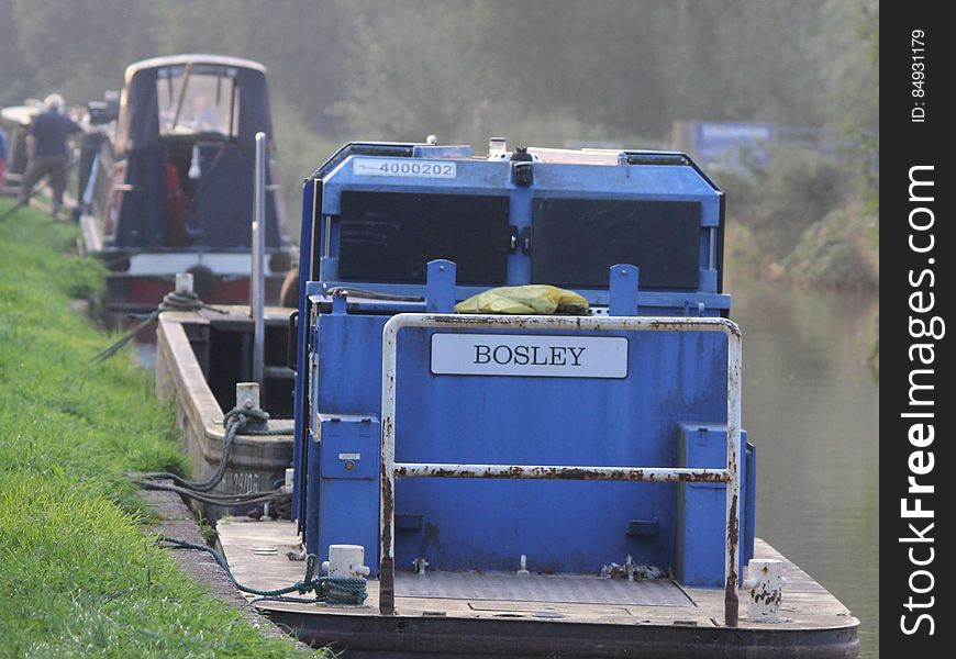 Bosley boat tied to waterfront on sunny day. Bosley boat tied to waterfront on sunny day.