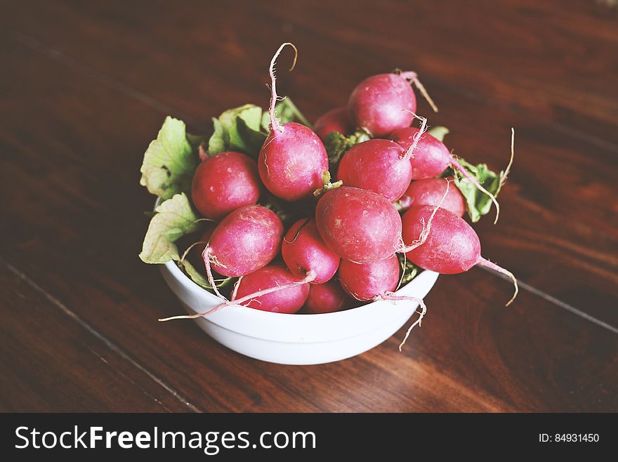 A bowl of fresh red radishes. A bowl of fresh red radishes.