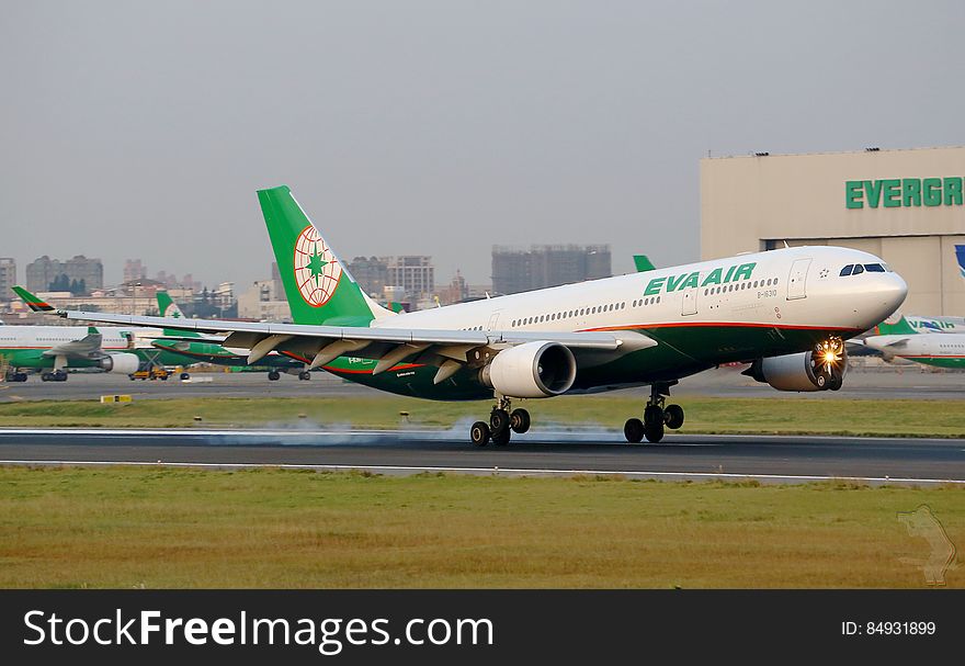 Eva Air jet plane landing. A plane belonging to the Taiwanese Airline, part of Evergreen Group, operating cargo and passenger services to 42 destinations. Eva Air jet plane landing. A plane belonging to the Taiwanese Airline, part of Evergreen Group, operating cargo and passenger services to 42 destinations.