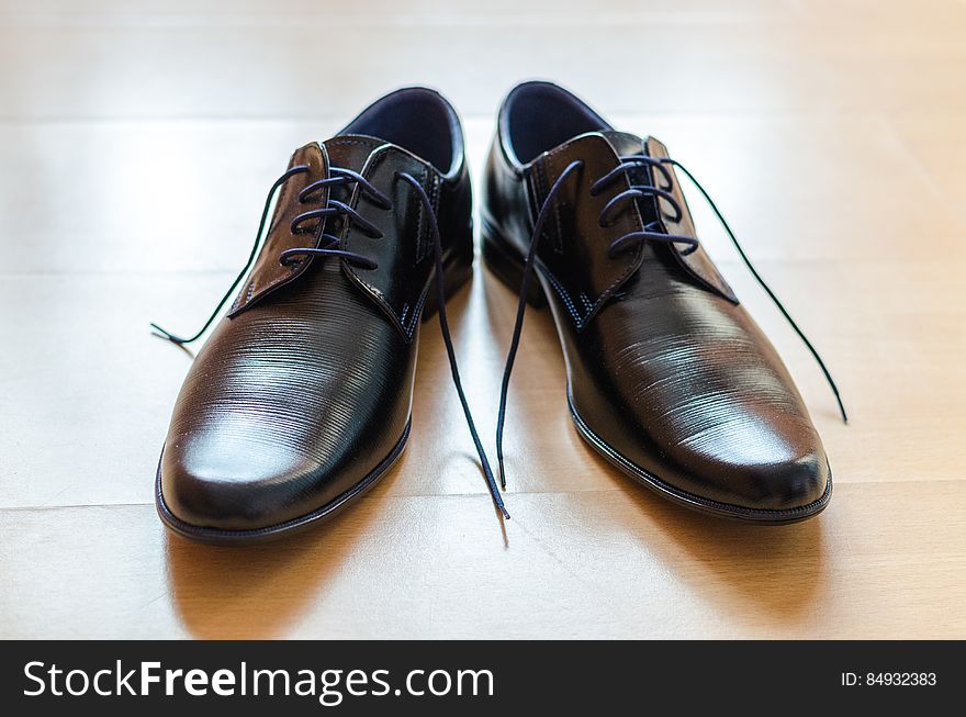 A close up of a pair of black man shoes. A close up of a pair of black man shoes.
