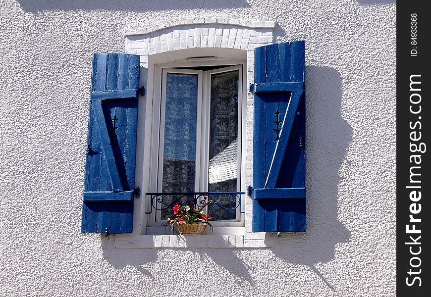 Window With Blue Shutters