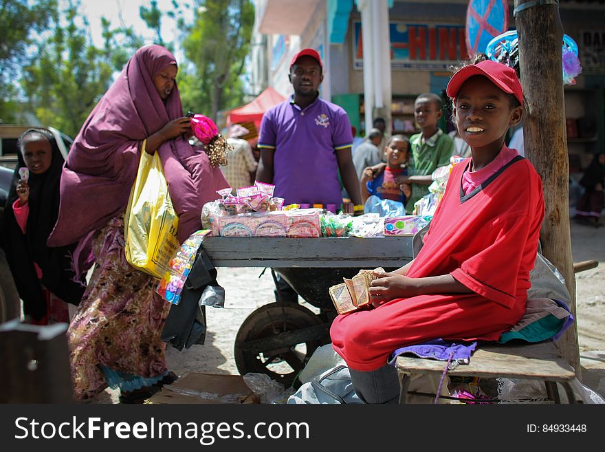 A woman shops at a roadside stall in Hamar Weyne market in the Somali capital Mogadishu, 05 August, 2013. 06 August marks 2 years since the Al Qaeda-affiliated extremist group Al Shabaab withdrew from Mogadishu following sustained operations by forces of the Somali National Army &#x28;SNA&#x29; backed by troops of the African Union Mission in Somalia &#x28;AMISOM&#x29; to retake the city. Since the group&#x27;s departure the country&#x27;s captial has re-established itself and a sense of normality has returned. Buildings and infrastructure devastated and destroyed by two decades of conflict have been repaired; thousands of Diaspora Somalis have returned home to invest and help rebuild their nation; foreign embassies and diplomatic missions have reopened and for the first time in many years, Somalia has an internationally recognised government.. AU-UN IST PHOTO / STUART PRICE. A woman shops at a roadside stall in Hamar Weyne market in the Somali capital Mogadishu, 05 August, 2013. 06 August marks 2 years since the Al Qaeda-affiliated extremist group Al Shabaab withdrew from Mogadishu following sustained operations by forces of the Somali National Army &#x28;SNA&#x29; backed by troops of the African Union Mission in Somalia &#x28;AMISOM&#x29; to retake the city. Since the group&#x27;s departure the country&#x27;s captial has re-established itself and a sense of normality has returned. Buildings and infrastructure devastated and destroyed by two decades of conflict have been repaired; thousands of Diaspora Somalis have returned home to invest and help rebuild their nation; foreign embassies and diplomatic missions have reopened and for the first time in many years, Somalia has an internationally recognised government.. AU-UN IST PHOTO / STUART PRICE.