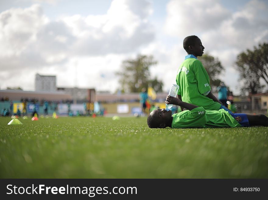 Two children take a break from training at the FIFA Football Festival in Mogadishu, Somalia, on August 19. FIFA, having had no presence in Somalia for the last 26 years, today held its first training session in Mogadishu since the country fell into civil war. Illegal under al Shabab, football has made a huge comeback in Somalia, with Mogadishu&#x27;s streets literally filling up with children each afternoon as they come out to play the game. AU UN IST PHOTO / TOBIN JONES. Two children take a break from training at the FIFA Football Festival in Mogadishu, Somalia, on August 19. FIFA, having had no presence in Somalia for the last 26 years, today held its first training session in Mogadishu since the country fell into civil war. Illegal under al Shabab, football has made a huge comeback in Somalia, with Mogadishu&#x27;s streets literally filling up with children each afternoon as they come out to play the game. AU UN IST PHOTO / TOBIN JONES.