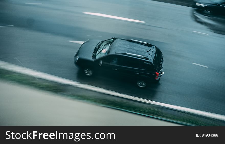 Aerial View Of Car Driving On Road