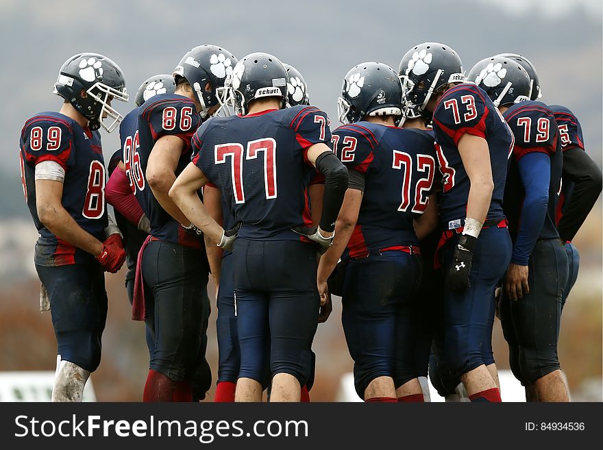 Huddle Of American Football Players
