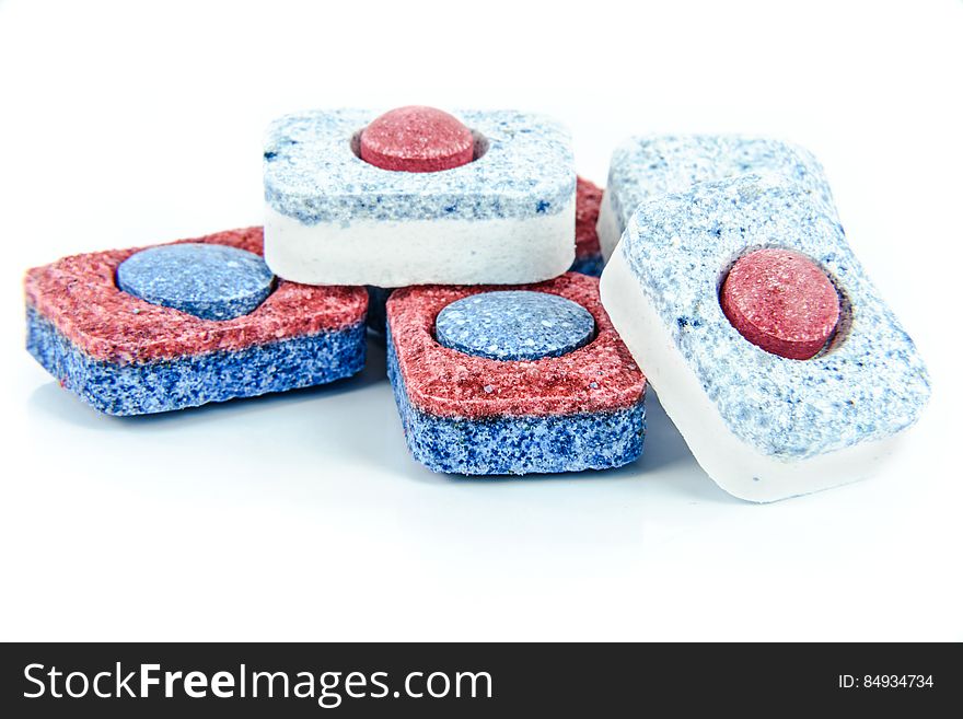 Several dishwasher detergent tablets on a white background. Several dishwasher detergent tablets on a white background.