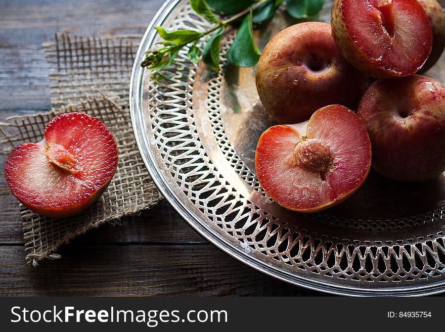 Sliced Plums on Silver Round Platter