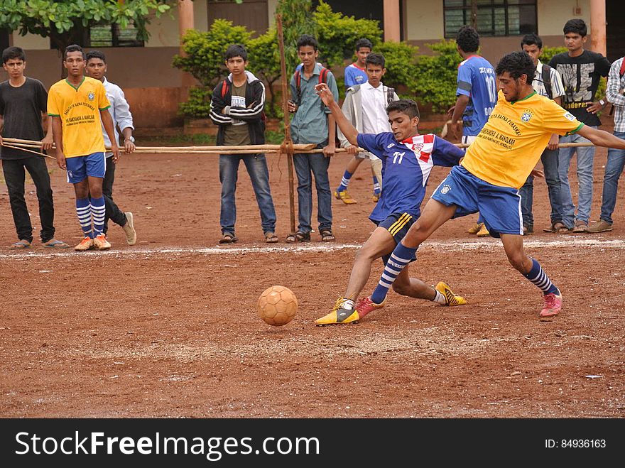 Two teams playing soccer in India. Two teams playing soccer in India.