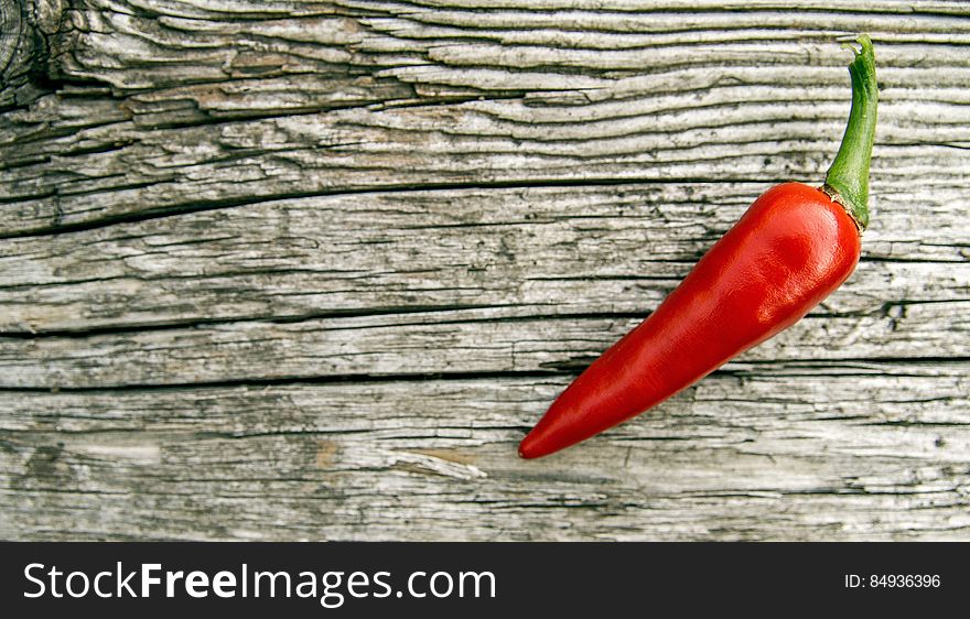 Chili Pepper On Wooden Background