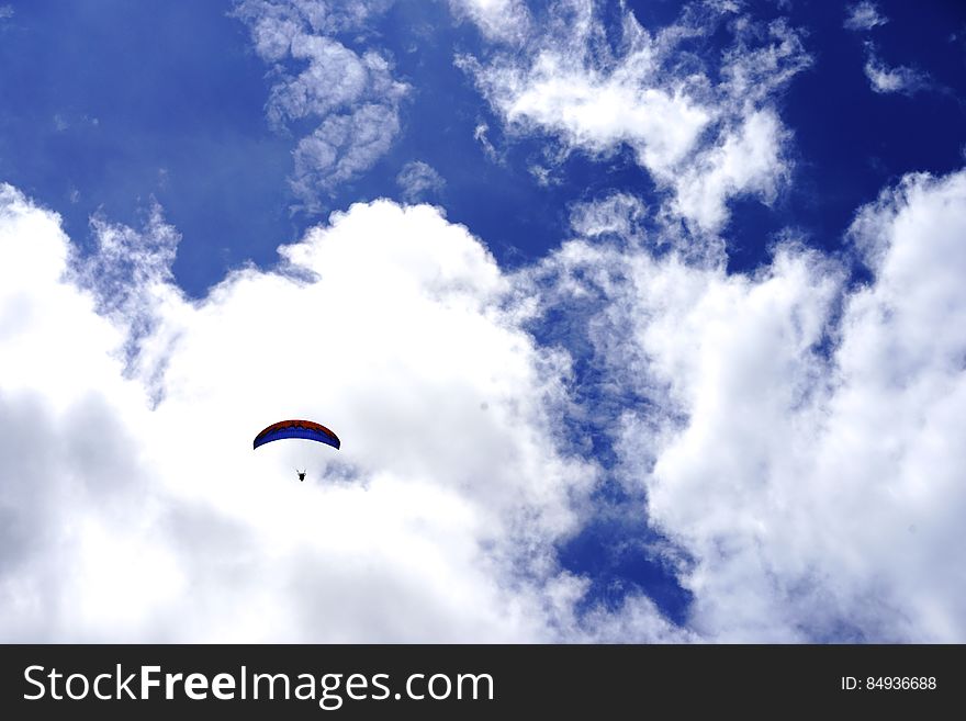 Low Angle View of Paragliding Against Sky
