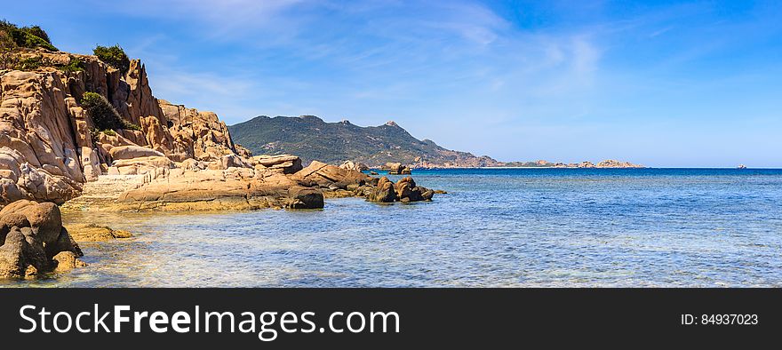 A stone cove and the sea.